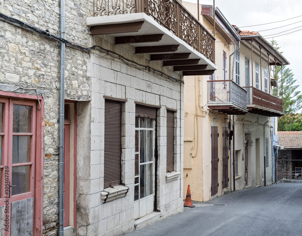 Vanishing street with vintage buildings. Pano Lefkara, Cyprus.
