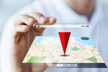 close up of male hand showing smartphone and map