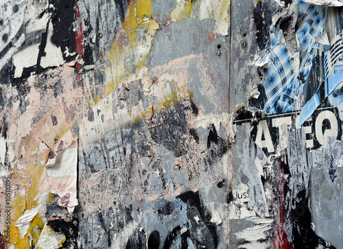 layered posters and graffiti background photo