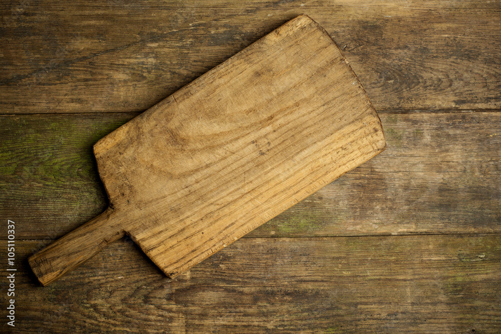 Rustic kitchen board on wooden background Rustic kitchen board on wooden background
