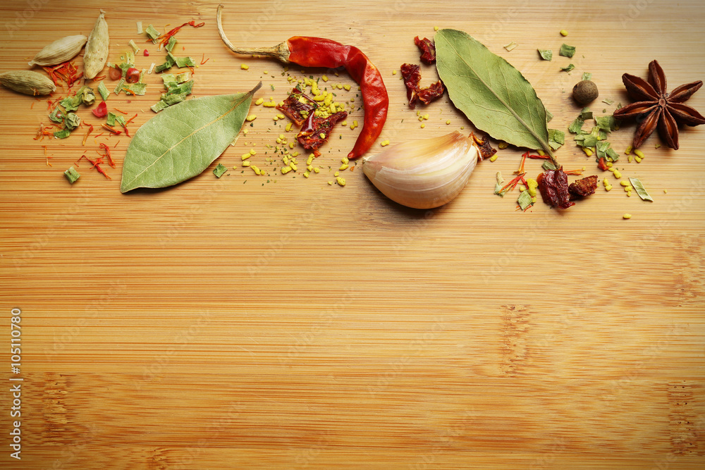 Different spices on cutting board, closeup Different spices on cutting board, closeup