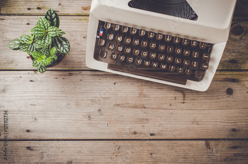 Retro typewriter on wooden table photo