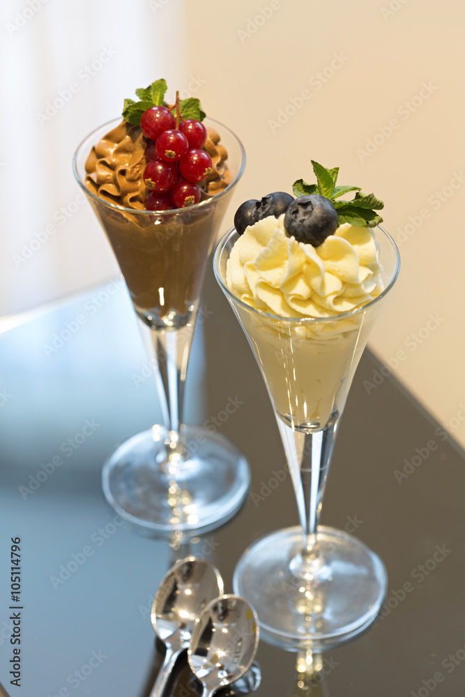 Chocolate and vanilla ice cream served on a table in hotel room Chocolate and vanilla ice cream served on a table in hotel room