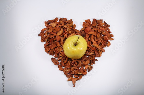 Yellow apple in the heart of the sliced apples