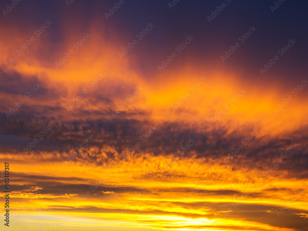 Fototapeta premium Blue and yellow stripes sky and clouds at sunset - pattern