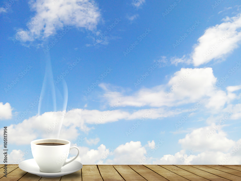 Hot Coffee cup on wood floor and sky