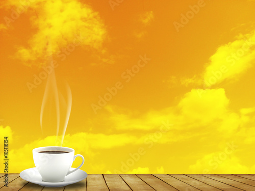 Hot Coffee cup on wood floor and evening sky