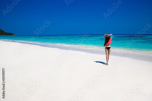 Free Happy Woman Enjoying tropical beach nature. Wellness. Trave