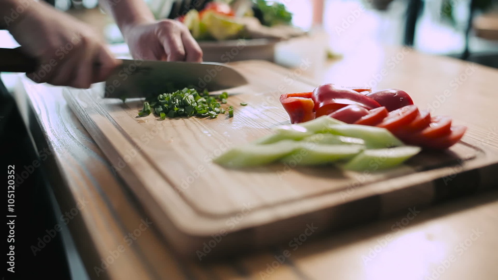 Cook chopped green onions on a cutting board Stock Video | Adobe Stock