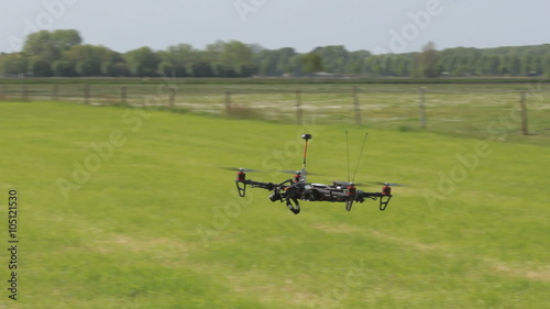 Drone starts  flying in the sky, view from the bottum up photo