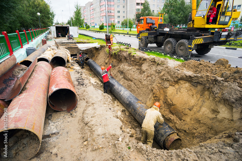 Repair excavation to replace pipes in  heating main.
