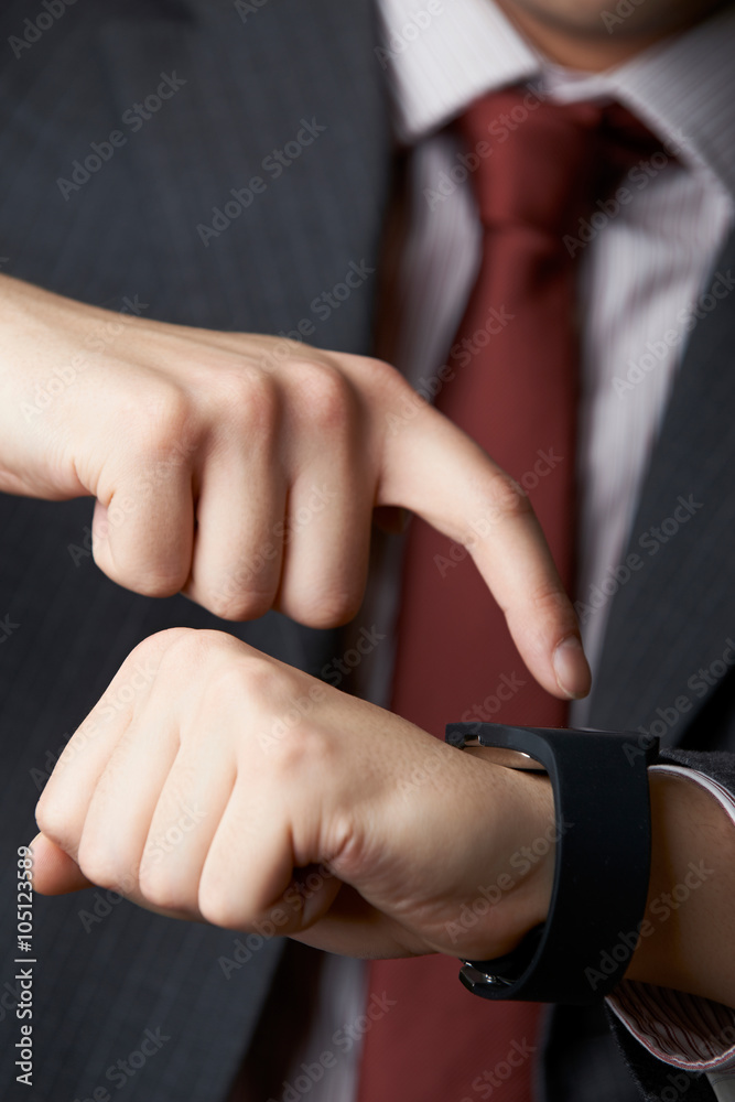 Fototapeta premium Close Up Of Businessman Using Smart Watch