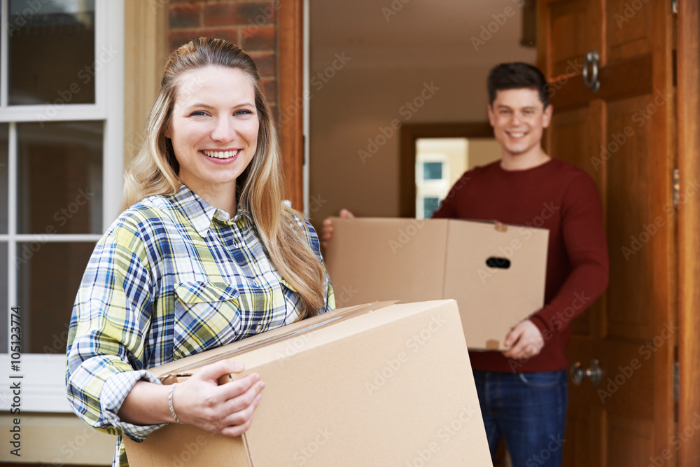 Young Couple Moving In To New Home Together Young Couple Moving In To New Home Together