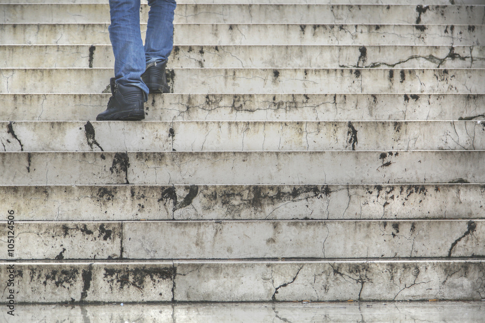 Man walking climb up in old stairs Man walking climb up in old stairs