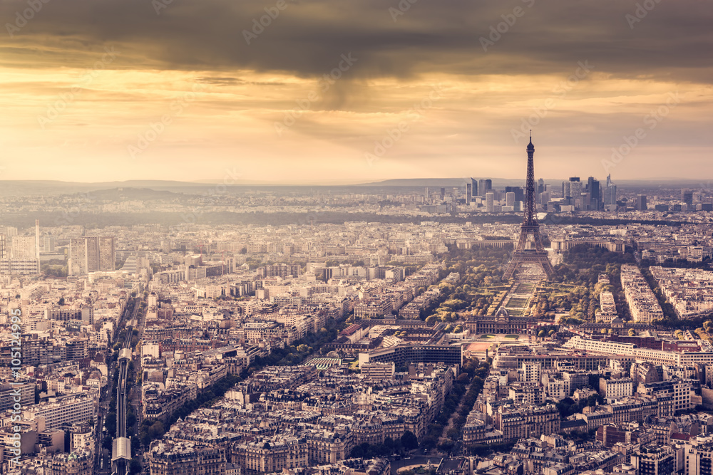 Paris, France skyline at sunset. Eiffel Tower in romantic golden light