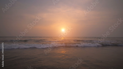 Wallpaper Mural Sunset on the beach, waves slowly splashing on the sand Torontodigital.ca