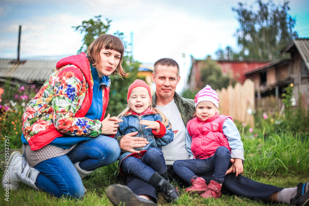 happy young couple with their children have fun at beautiful park outdoor in nature. happiness a family happy young couple with their children have fun at beautiful park outdoor in nature. happiness a family