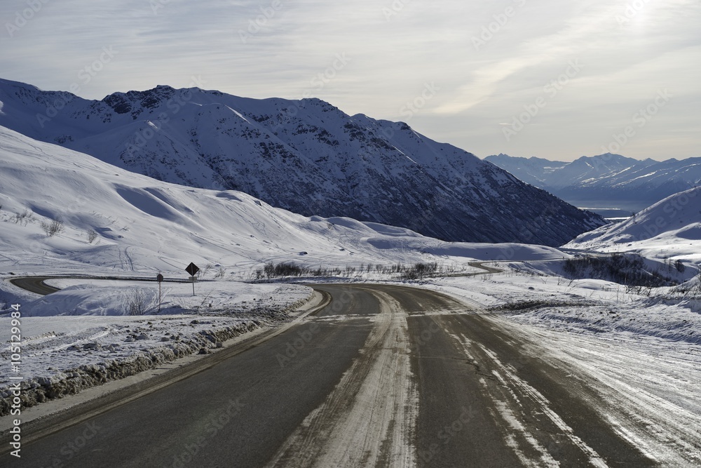 Winding road through mountains in the winter