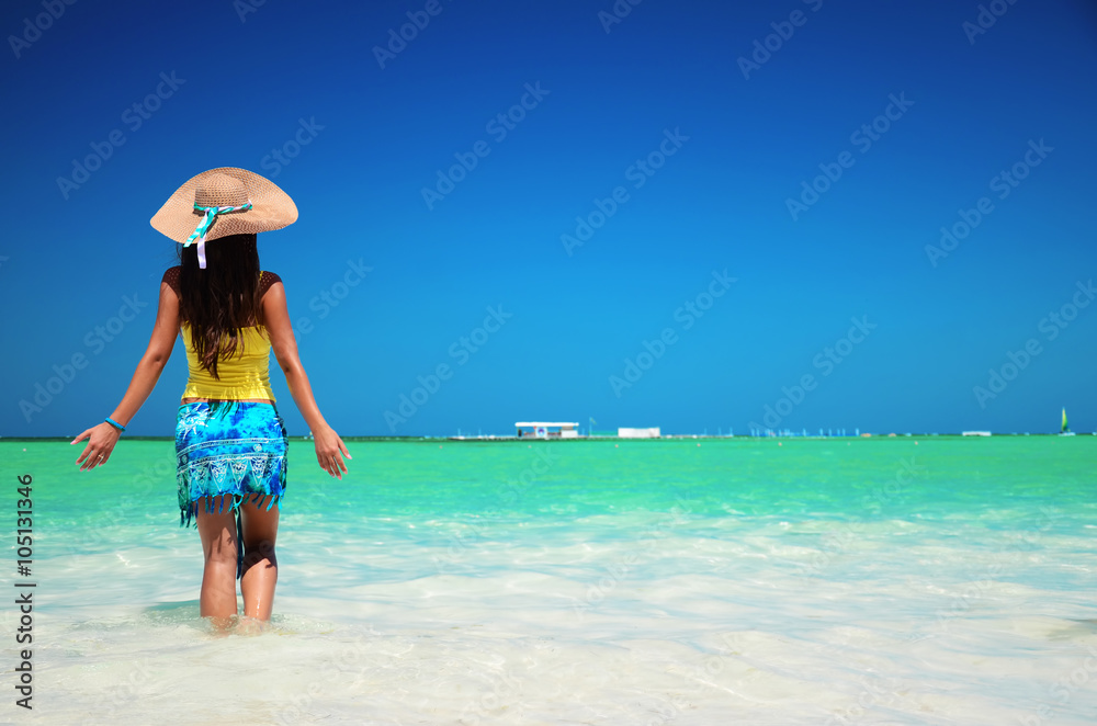 Young woman relaxing on tropical carribean beach Young woman relaxing on tropical carribean beach