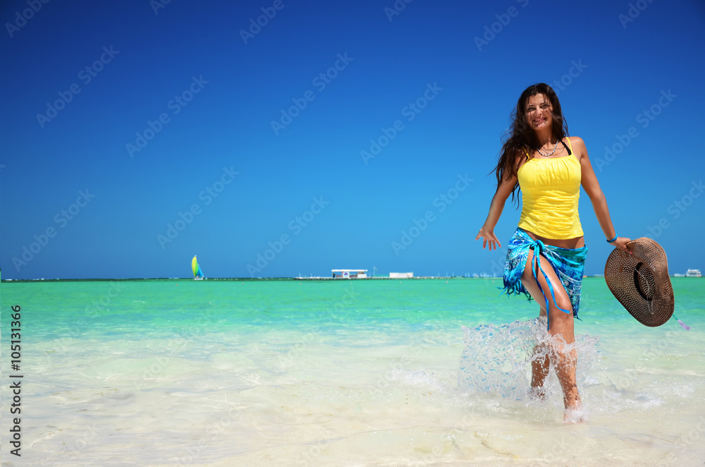 Young woman relaxing on tropical carribean beach Young woman relaxing on tropical carribean beach