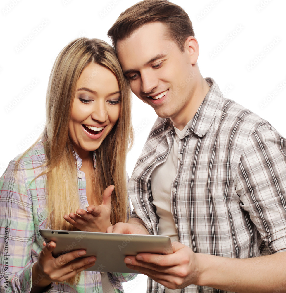 happy young couple holding tablet pc computer happy young couple holding tablet pc computer