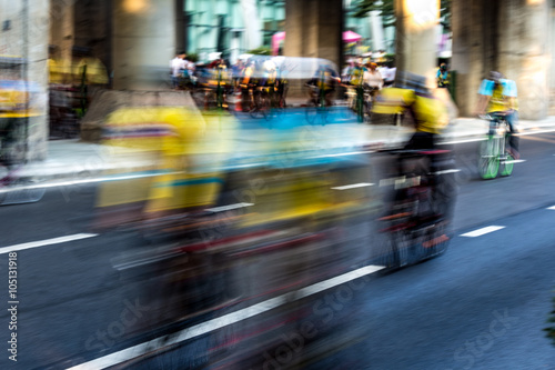 bicycle race , group of people on bikes - motion blur abstract