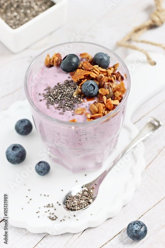 Overnight chia seeds and blueberry yogurt with homemade granola.Healthy eating concept.Selective focus