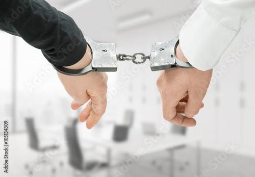 Hands in handcuffs photo