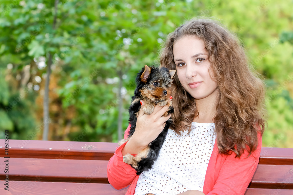 woman beautiful young happy with long hair holding small dog on woman beautiful young happy with long hair holding small dog on