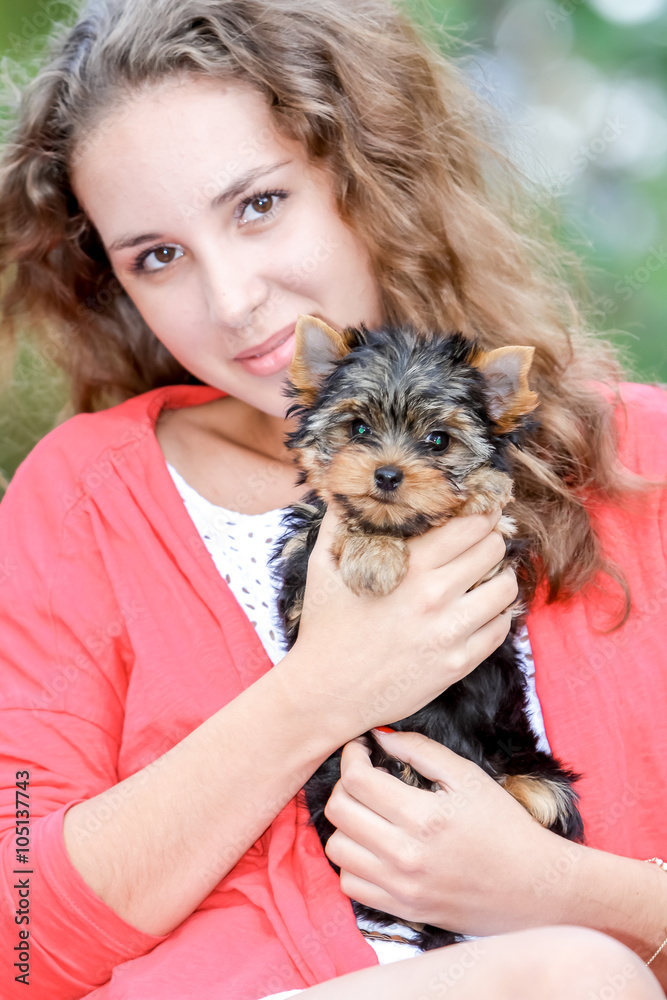 woman beautiful young happy with long hair holding small dog on woman beautiful young happy with long hair holding small dog on
