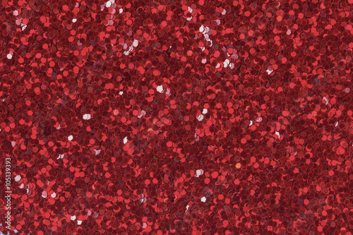 Red glitter texture for background. Low contrast photo.