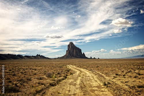 Dirt road on the way to Shiprock a Navajo spirit butte in northwest New Mexico. photo