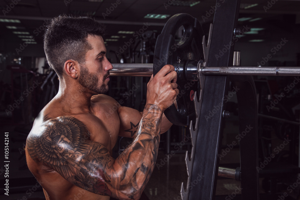 Handsome muscular man in the gym. Handsome muscular man in the gym.