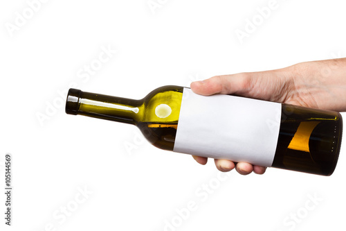 open bottle of white wine with a clear sticker in hand isolated