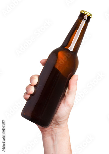 brown beer bottle in hand isolated on white background
