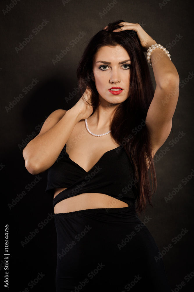 woman in sensual black dress on dark woman in sensual black dress on dark