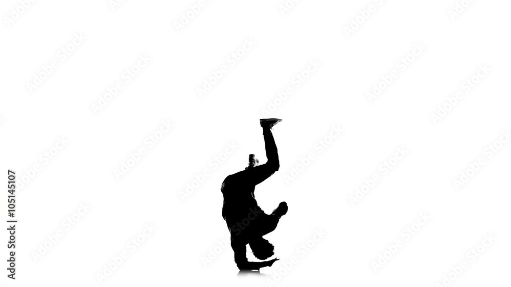 Dancer jumps and stands on hands dancing breakdance, makes movement, white, silhouette, slow motion Dancer jumps and stands on hands dancing breakdance, makes movement, white, silhouette, slow motion