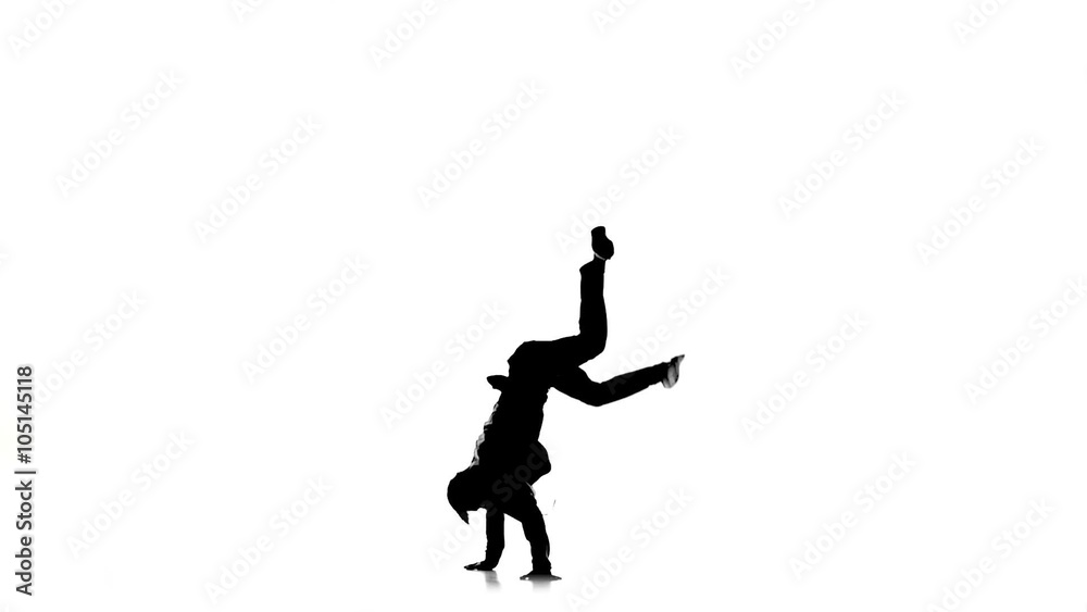 Young man jumps and stands on hands dancing breakdance, white, silhouette, slow motion Young man jumps and stands on hands dancing breakdance, white, silhouette, slow motion