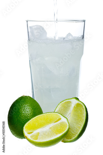 Mojito and limes in a glass on a white background