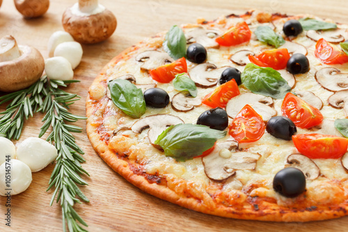 Pizza with mushrooms and ve...