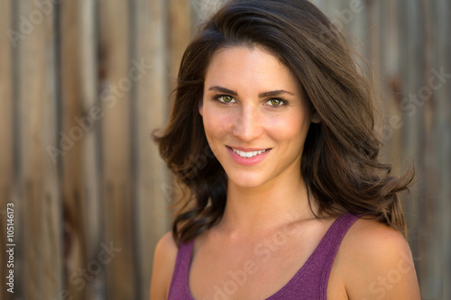 Beautiful brunette model head shot outdoor perfect straight white smile latin latina mixed race 