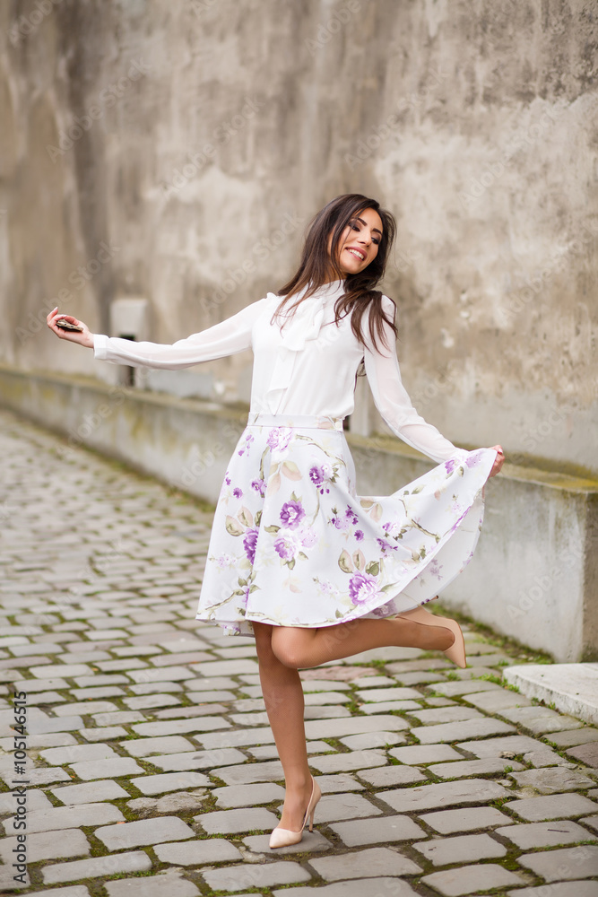 Fashionable Young Blissful woman enjoying freedom and life