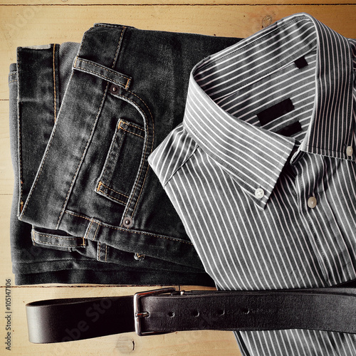 Man clothing flat on wood background photo