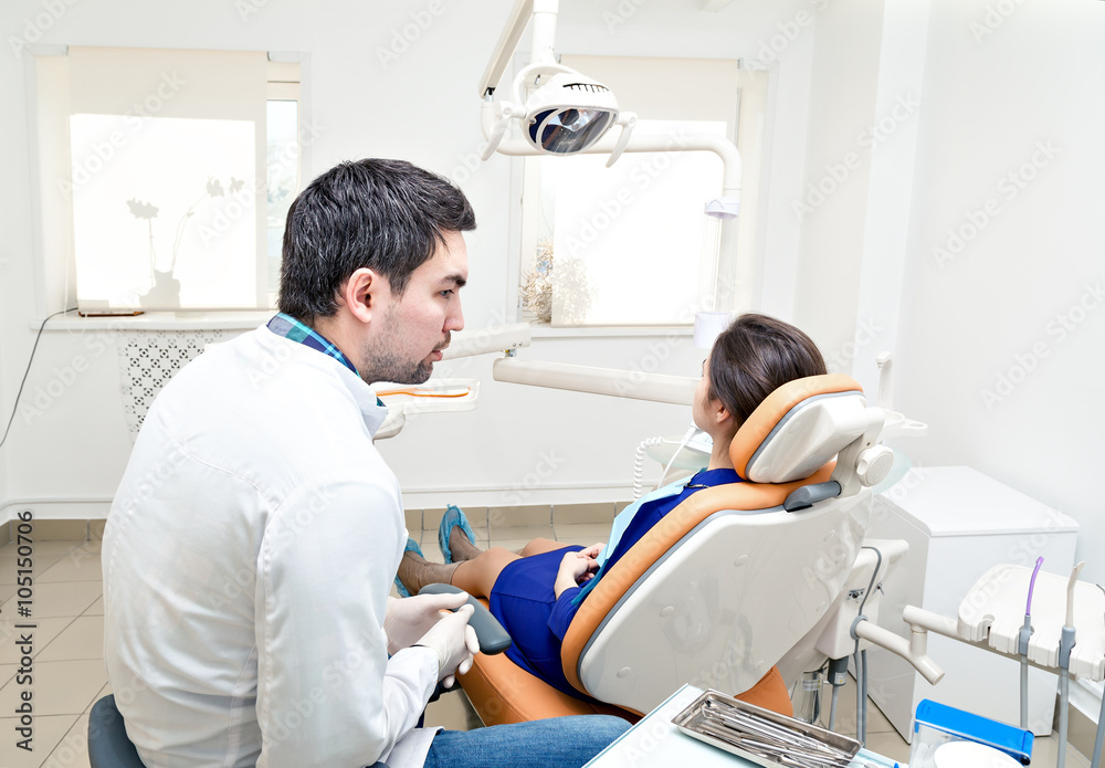 dentist in a dental clinic. The girl on reception at the dentist's chair. dentist in a dental clinic. The girl on reception at the dentist's chair.