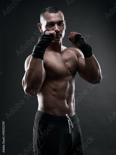Fighter boxer on black background © Restyler