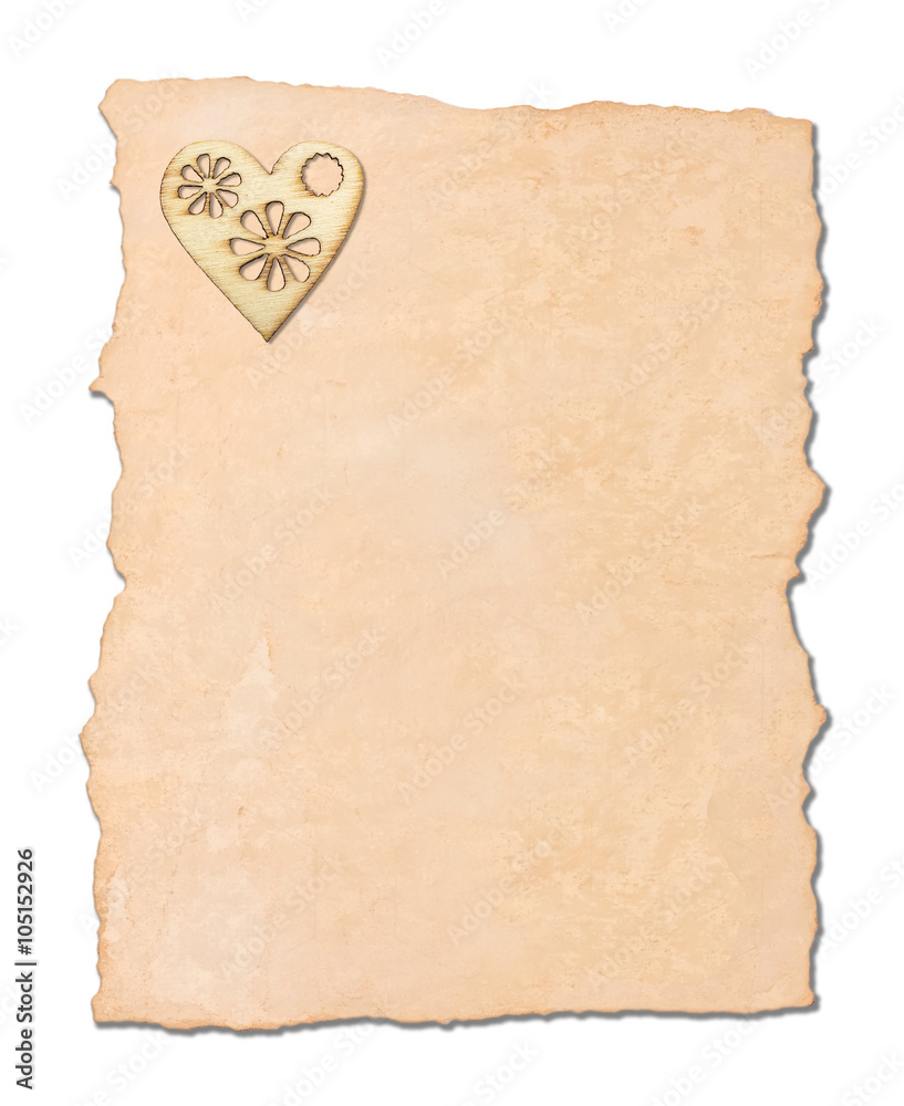 Graceful wooden heart, with a burned pattern on old paper, isolated on white