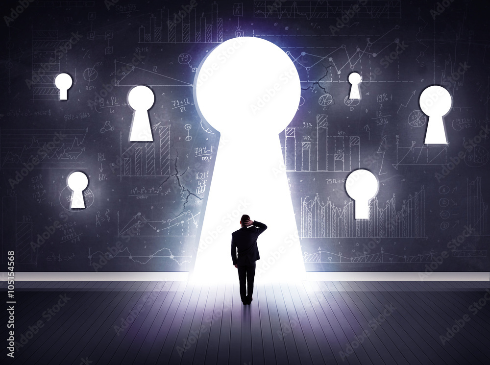 Obraz premium businessman looking through keyhole