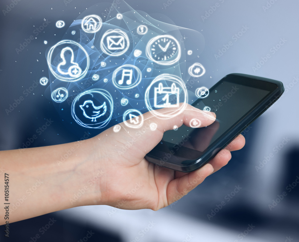 Hand holding smartphone with mobile app choices Hand holding smartphone with mobile app choices