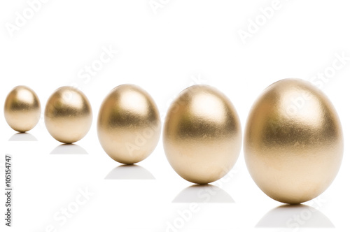 Golden eggs from isolated on a white background. 