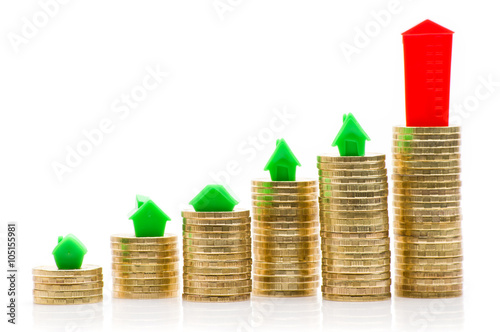 Stacks of coins, green and red home 